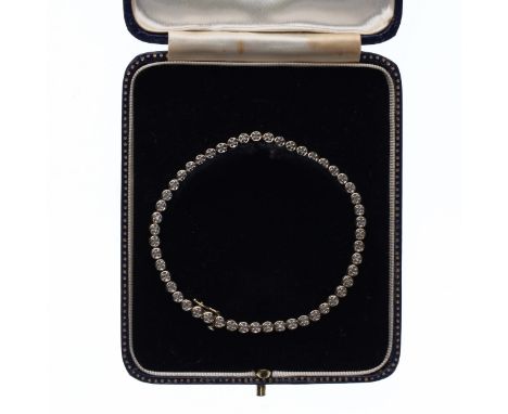 Diamond and 9ct Gold Tennis Bracelet. Measures approx. 18.5cm. Hallmarked on the tongue of the clasp. Signs of age and wear a