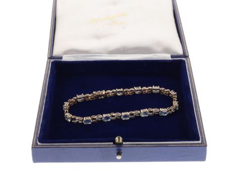 Topaz and Diamond 9ct Gold Tennis Bracelet. Measures approx. 18.5cm. Stamped 375 near the tongue. Clasp and safety catch in w