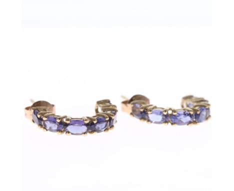 Iolite 9ct gold hoop earrings. These earrings are stamped 9k on their reverse. The earrings measure approximately 1.7cm in le
