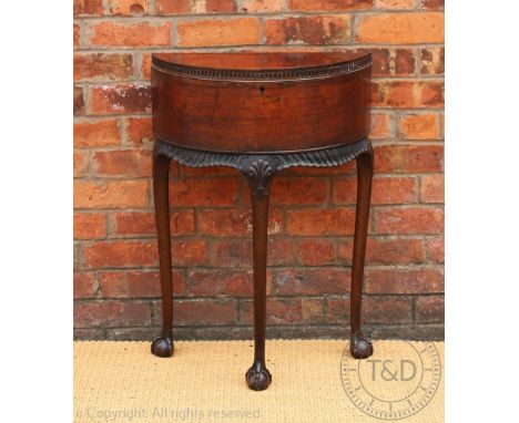 A George II style carved mahogany Irish influence demi-lune side table, c1910, on tapered leg with claw and ball feet, 82cm H