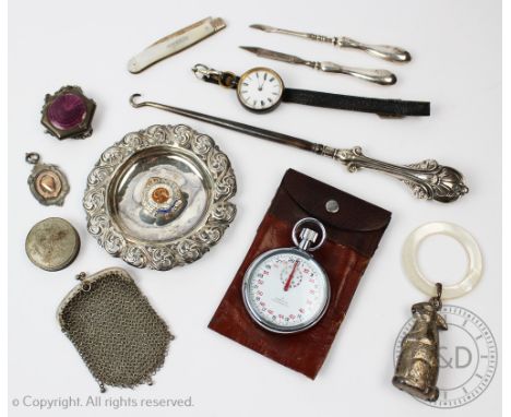 A selection of silver to include; A child's rattle in the form of a rabbit and a mother of pearl teething ring, a silver dish