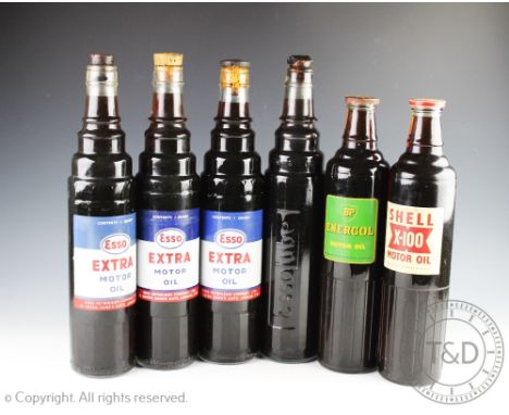 Six vintage oil advertising bottles and contents, comprising three Esso Extra Motor Oil bottles, a Shell X-100 Motor Oil bott