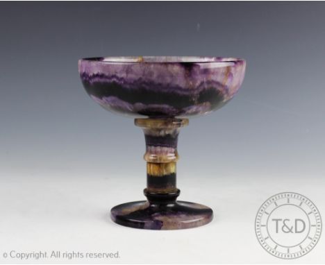 A 19th century Derbyshire fluorspar Blue John pedestal bowl, the circular bowl raised on a ringed stem and spreading circular