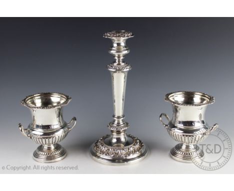 A pair of late Victorian silver plated twin handle pedestal urns, 13.5cm, with a silver plated candlestick (3)