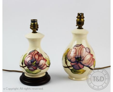 Two Moorcroft Magnolia pattern table lamps, tallest 26cm including bulb fitting (2)   CONDITION REPORT:  Lighting lots are so