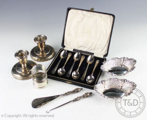 A pair of Victorian pierced silver bon bon dishes, James Dixon and Son, Sheffield, 1896, with two silver napkin rings, a set 