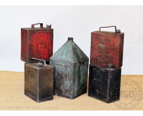 Five vintage metal petrol cans, comprising a BP can, three Shell and a Light Shale Oil can (the latter with no handle), and a