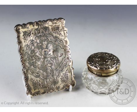 A Victorian silver card case, Yapp & Woodward, Birmingham 1854, of serpentine form and engraved with flowers, 10cm, with a si