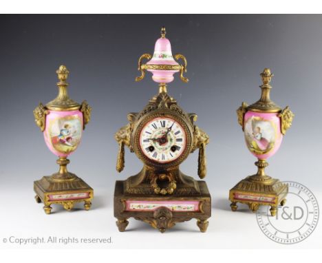 A 19th century French gilt metal and Sevres style porcelain mounted clock garniture, the clock with a Roman numeral dial and 