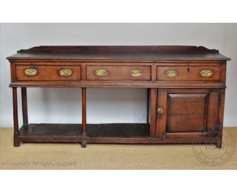 An 18th century and later oak dresser, possibly Welsh, with three drawers above a cupboard door and pot shelf, on turned legs