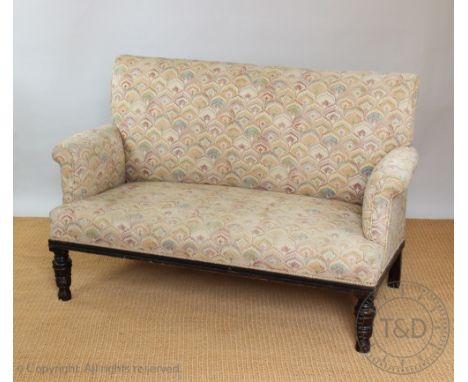 An Edwardian salon sofa, of club type, with later upholstery, on turned and tapered legs, 96cm H x 149cm W x 72cm D