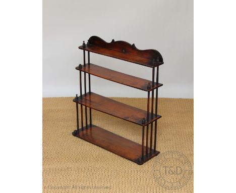 A Victorian mahogany four tier shelf, with spindle sides, 76cm H x 68cm W x 21cm D