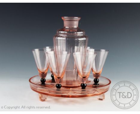 An Art Deco Argent pewter thee piece tea service and tray, each piece with a planished exterior with an Art Deco pink glass c