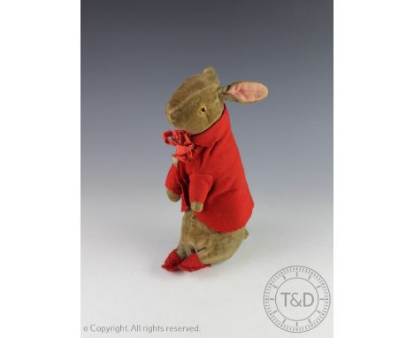 An early Beatrix Pottery Peter Rabbit soft toy, Steiff type, with amber coloured eyes, red jacket with remains of paper label