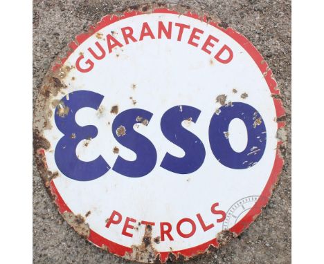 A vintage Guaranteed Esso Petrols vitreous enamel advertising sign, 75.5cm diameter