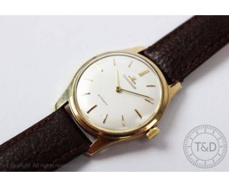 A 9ct gold Jaeger Le Coultre, Automatic wristwatch, the circular champagne dial with gilt batons, numbered to the back of the
