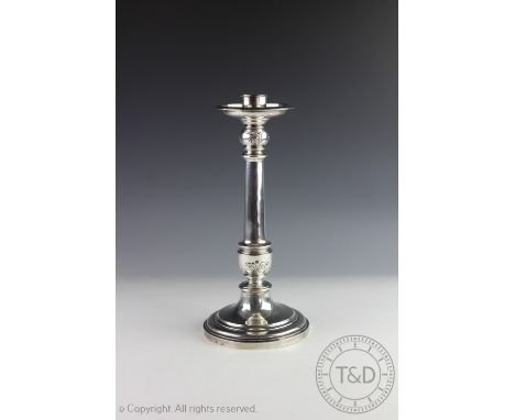 A silver candlestick Elkington and Co, Birmingham 1923, of baluster form, with tudor rose and anthemion detail, 32cm high (lo