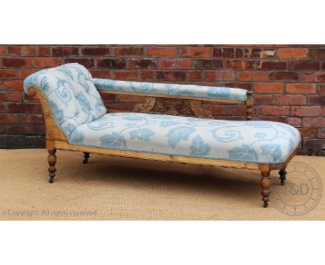 A late Victorian chaise, with button back floral upholstery (some sun fading), on turned legs, 174cm wide