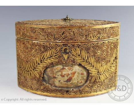 A late George III rolled paper scroll work tea caddy, of navette shape, decorated throughout with foliate motifs, lacking fro
