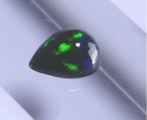 Pear cabochon black opal, approximately 0.97 ct, 8.70 x 6.67 x 4.17 mm