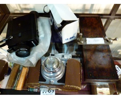 Box of cameras and a tie press 