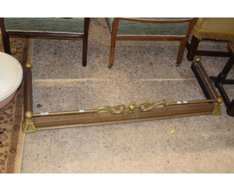 A brass fire fender