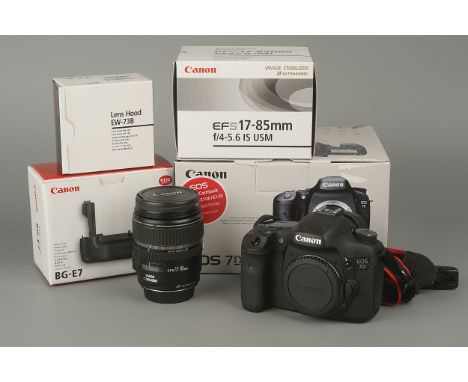 A Canon EOS 7D Digital SLR Camera,with Canon EF-S f/4-5.6 17-85mm lens and BG-E7 battery grip, all in maker's boxes (a lot)