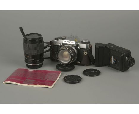 An Olympus OM20 SLR Camera,with two lenses and flash unit (a lot)