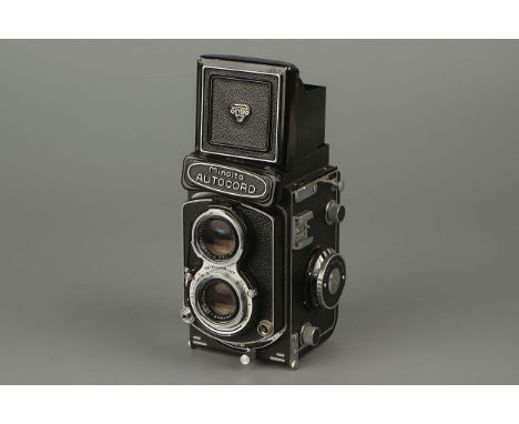 A Minolta Autocord TLR Camera,with Chiyoko Rokkor f/3.5 75mm lens, some damages to light meter and focusing not working