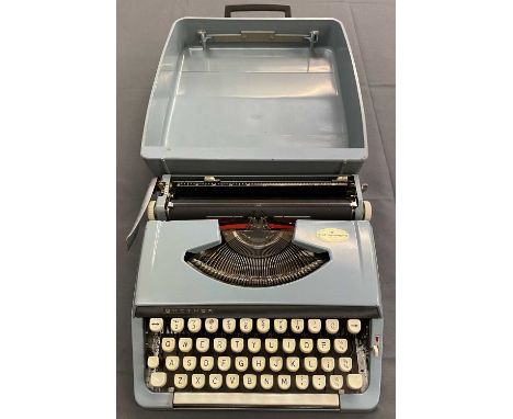 BROTHER PORTABLE TYPEWRITER - in hard blue case