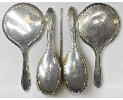 MONOGRAMMED OVAL SILVER BACKED HAIRBRUSHES, a pair - Birmingham 1906 and two circular silver backed non-matching hand mirrors