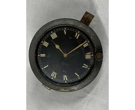 JAEGER BLACK DIAL AUTOMOBILE CLOCK - having a black dial set with Roman numerals, numbered to the back '461822', 9.25cms diam