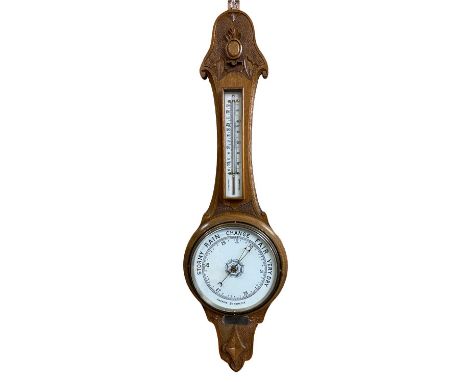 CARVED OAK ANEROID BAROMETER WITH THERMOMETER - 86cms L