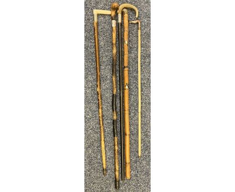 VINTAGE WALKING STICKS &amp; CANES (5) - to include two natural wood examples, one having white metal buckle collar, the othe