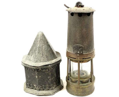 ANTIQUE LEAD TOBACCO BOX &amp; COVER and a vintage miner's lamp, 18 and 25cm heights respectively