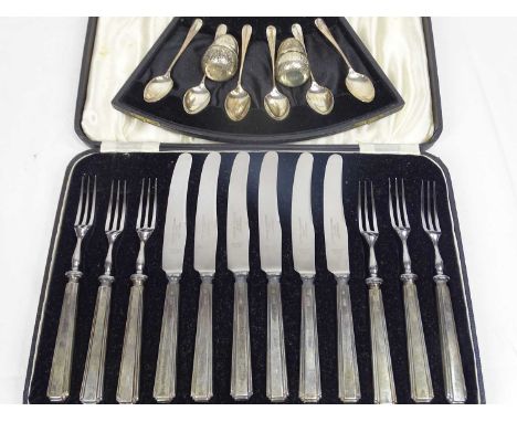 CASED SILVER FLATWARE, two sets and a pair of Continental pepper pots in the form of acorns, stamped 830S, the cased items in