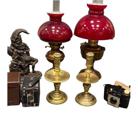 PERIOD BRASS CANDLESTICKS, a near pair with drip trays, 25.5cms H, two brass based oil lamps with cranberry glass shades, a P