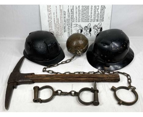 VINTAGE MINER'S HELMETS (2), pickaxe, heavy weight ball and chain and a pair of iron handcuffs with key labelled 'Collorado T