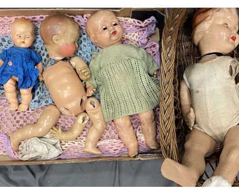 VINTAGE BISQUE/COMPOSITION DOLLS (4) - in varying conditions along with a wicker crib, 50cms L the longest