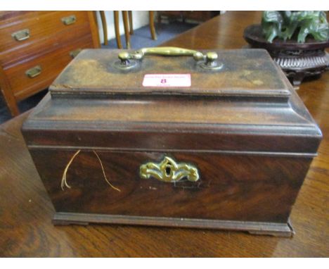 A George III mahogany tea caddy with a hinged lid enclosing three compartments 