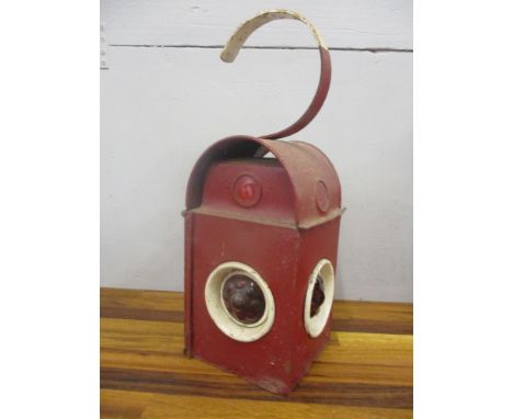A mid 20th century Kenyons red painted Serilight workman's oil lamp 