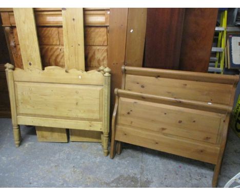 A Victorian pine bed frame, together with a modern pine sleigh bed frame 