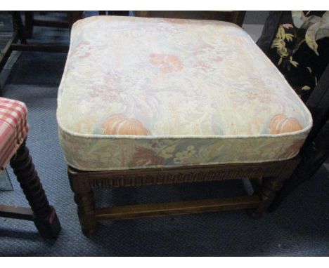 An Ercol two tier occasional table with fall flap and single drawer 18 1/2"h x 29"w, and a foot stool 