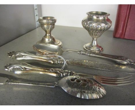 A Victorian three-piece silver christening set, a Georgian silver vase, a Victorian long spoon, and a late silver dwarf candl