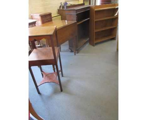 A Victorian mahogany Pembroke table, an early 20th century oak bookcase with carved, panel to the top and one and one single 