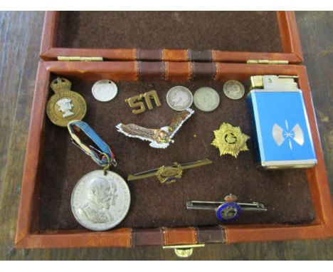 A mixed lot of badges, coins, a Coronation medal and Sankyo musical lighter, to include an 1875 one-dime coin (holed), an Arm