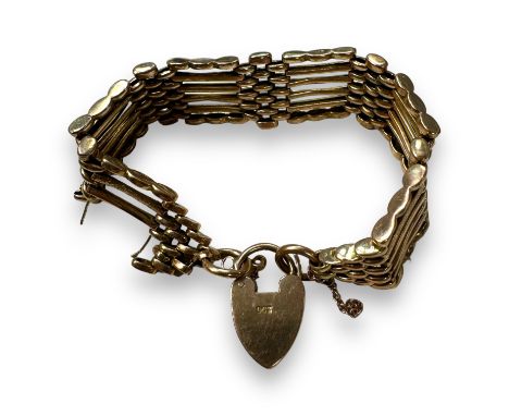 A "9ct" stamped gate bracelet, in precious rose metal, testing as 9ct gold. In as found condition due to one of the gates mis