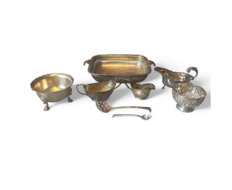 Assorted silver wares, to include an 18th century sifter spoon, a matching twin handled sugar bowl and cream jug, a repousse 