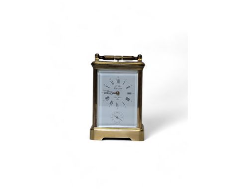 An early 20th century French L'Epee Sainte Luxanne brass repeating carriage clock, striking on a gong, the white enamel dial 