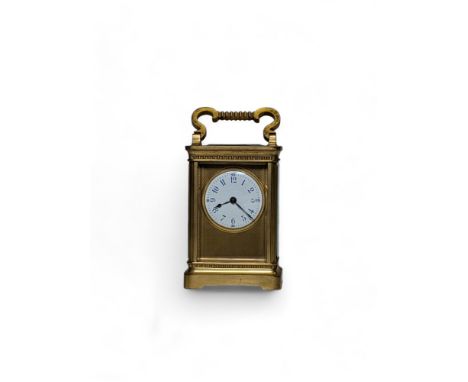 An early 20th century brass carriage clock, the white enamel dial with blue Arabic numerals and blued hands, the outer second